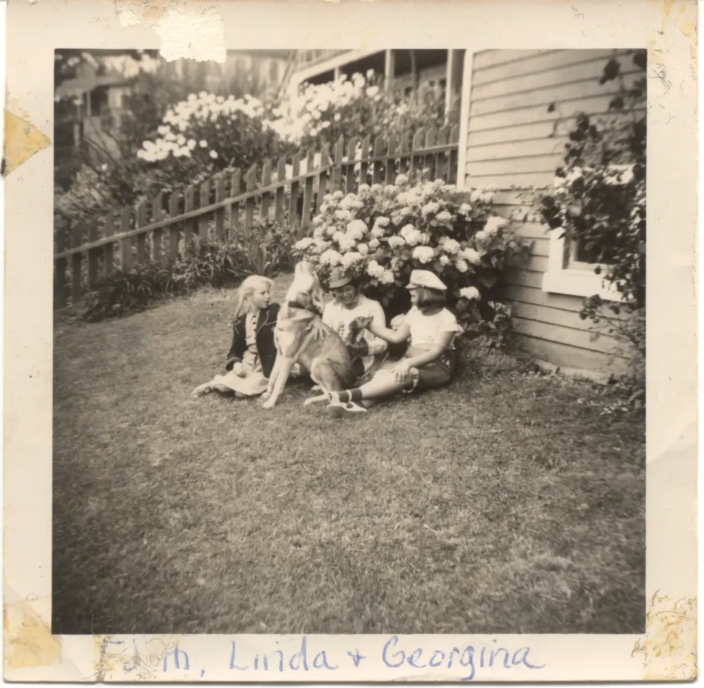 Three people relaxing on a lawn beside hydrangeas, captioned Edith, Linda and Georgina in ink.